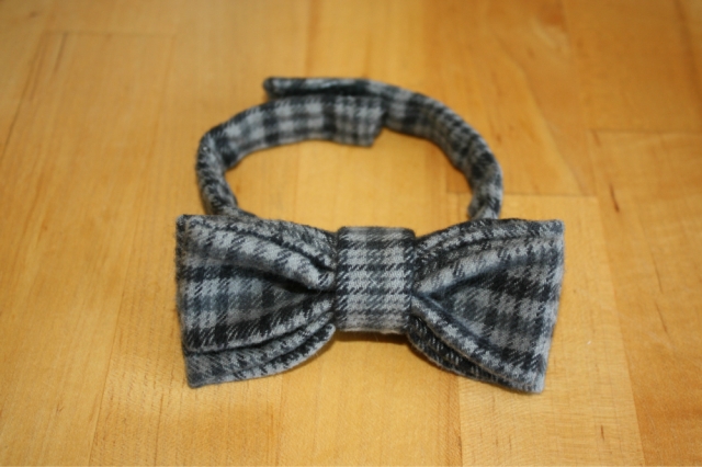 finished black and grey flannel bow tie with ends velcroed together
