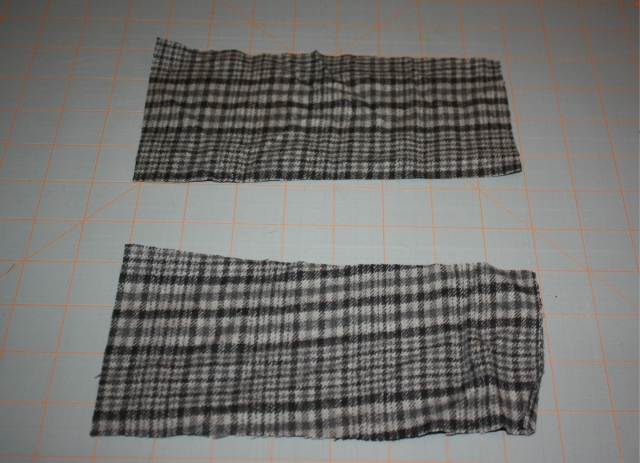 Two pieces of 8 inch by 3 1/2 inch flannel material