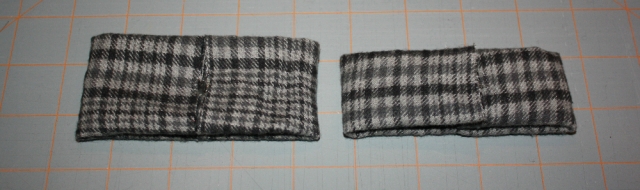 your first piece beside your second smaller piece, both folded into rectangles